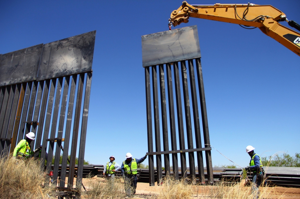 Workers replace an old section of the wall between the US and Mexico in Santa Teresa, New Mexico, close to Ciudad Juarez in Mexico’s Chihuahua State, in this April 23, 2018 file photo. — AFP