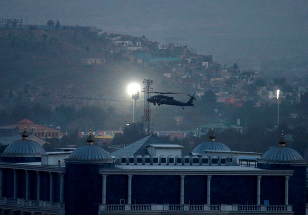 A NATO helicopter lands at the Resolute Support headquarters in Kabul, Afghanistan, on Thursday. — Reuters