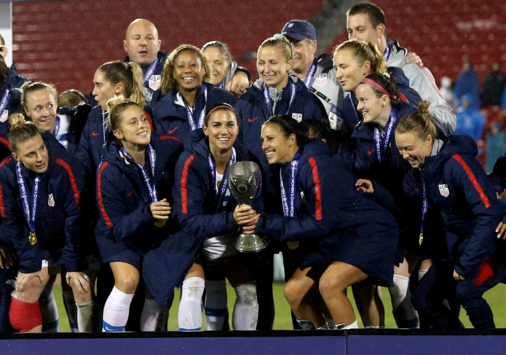 United States forward Alex Morgan (middle) celebrates with teammates after defeating Canada in the 2018 CONCACAF Women's Championship final soccer match at Toyota Stadium in Frisco, Texas. — Reuters