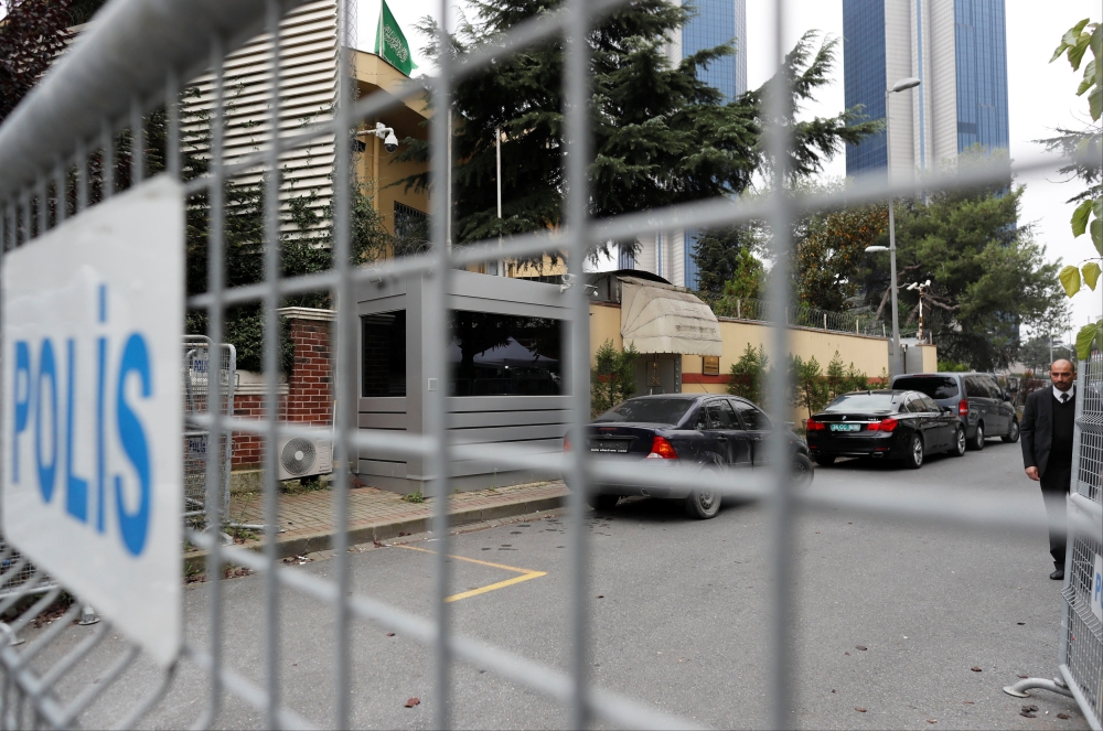 A member of security staff is seen next to the barriers at the gate of Saudi Arabia's consulate in Istanbul, Turkey, on Sunday. — Reuters