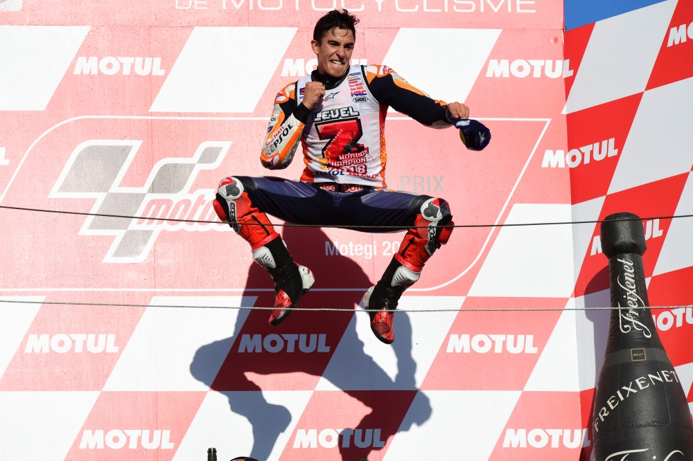 


Repsol Honda Team Spanish rider Marc Marquez celebrates on the podium of the MotoGP Japanese Grand Prix at Twin Ring Motegi circuit in Motegi Sunday. — AFP 