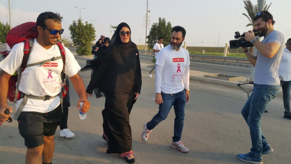 


Princes Haifa and Samer Kurdi walk with Yasser Al-Humaid (L) after the reception in Asfan.