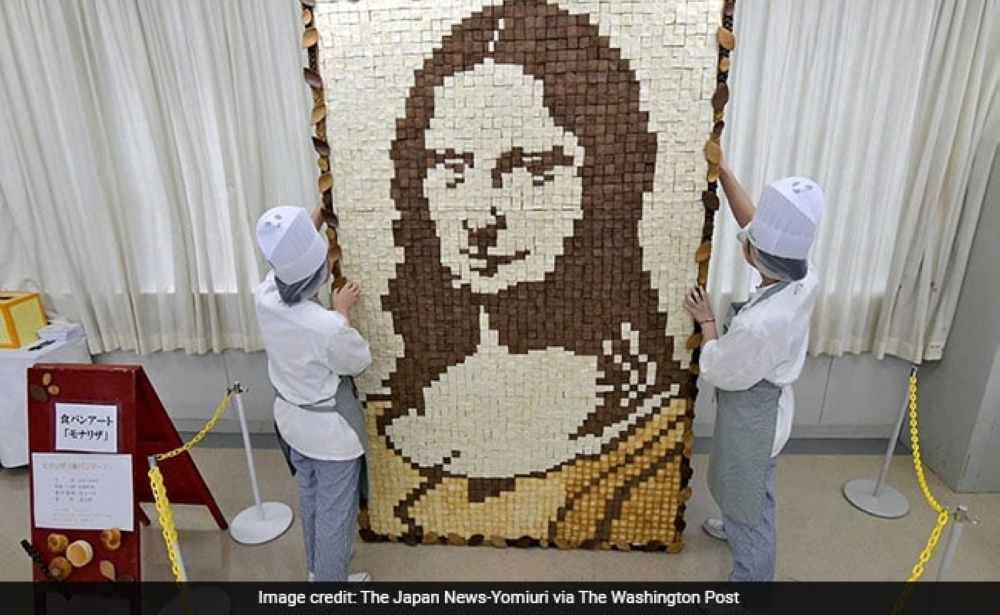 


A group of about 30 students spent about two months completing the work, which is 2.4 meters (about 7.8 feet) tall and 1.5 meters wide. 