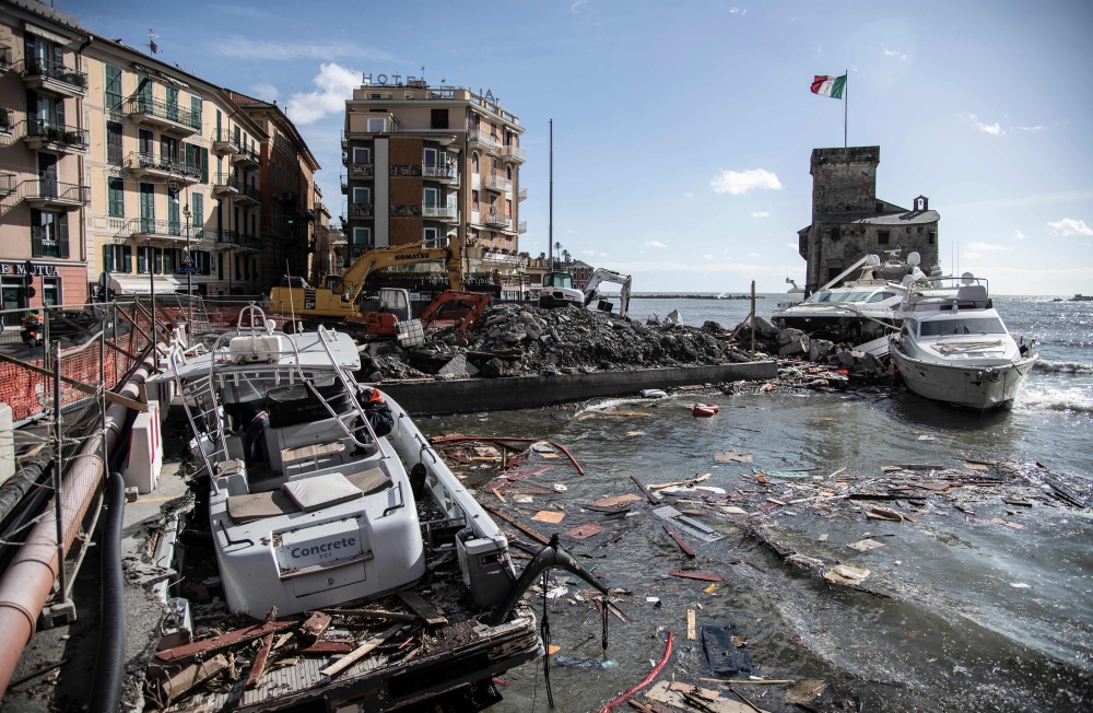 Destroyed boats and yachts stand near the Castle of Rapallo after a storm hit the harbor and destroyed a part of the dam in Rapallo, near Genoa, Italy, on Tuesday. — AFP