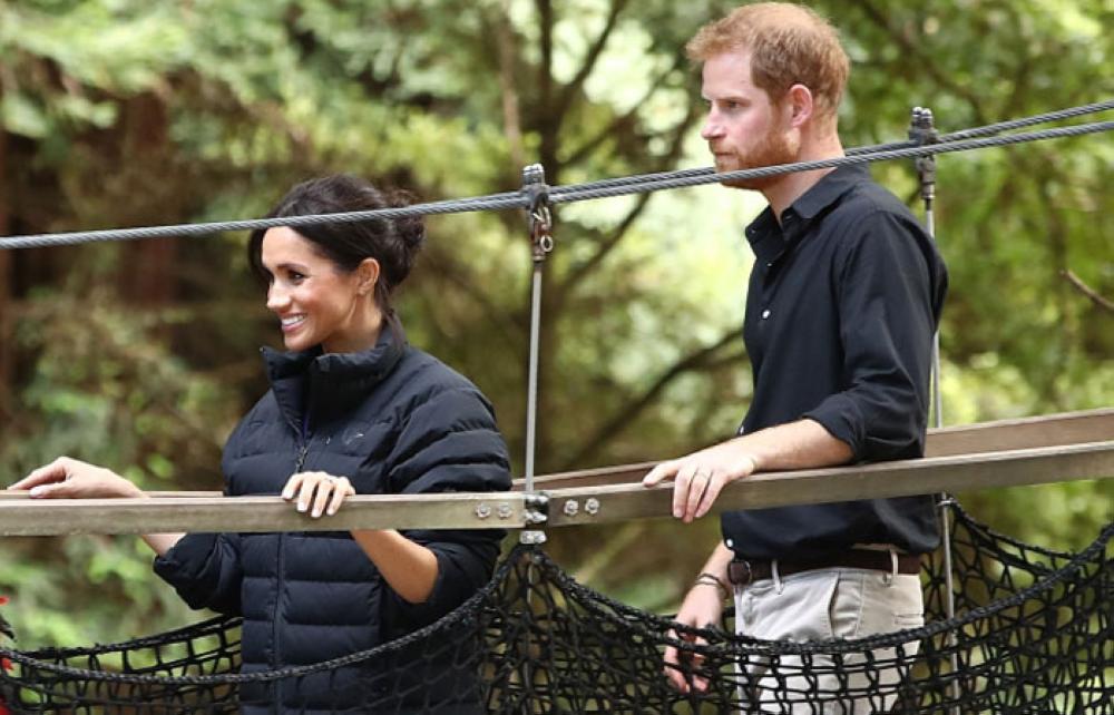 Britain’s Prince Harry and his wife Meghan, Duchess of Sussex visit Redwoods Tree Walk in Rotorua on Wednesday.  The Duke and Duchess of Sussex are on a three-week tour of Australia, New Zealand, Tonga, and Fiji. — AFP