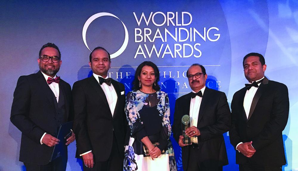 



Ashraf Ali Musliam, Executive Director of LuLu Group,  along with Adeeb Ahamed, MD of LuLu Financial Group; Shafeena Yusuffali, CEO of Tablez; Mohammed Althaf, Director and V. Nandakumar, CCO of LuLu Group, with the Brand of the Year Trophy at the World Branding Award Ceremony at the Kensington Palace in London.
