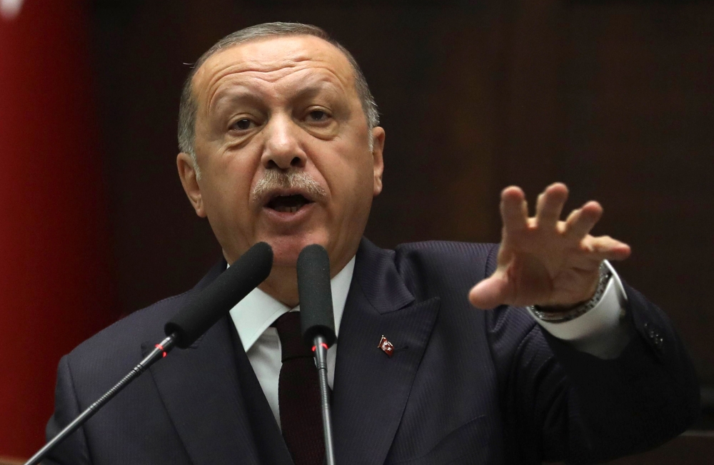 


Turkish President Recep Tayyip Erdogan makes a speech as he attends the parliamentary group meeting of ruling Justice and Development (AK) Party at the Grand National Assembly of Turkey on Tuesday in Ankara. — AFP