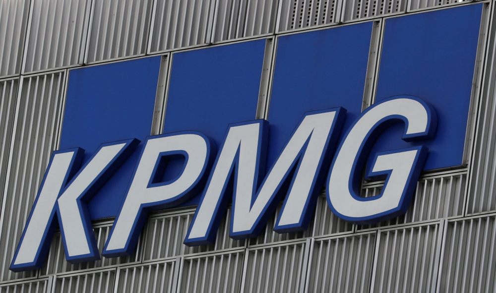 The KPMG logo is seen at their offices at Canary Wharf financial district in London,Britain, in this file photo. — Reuters