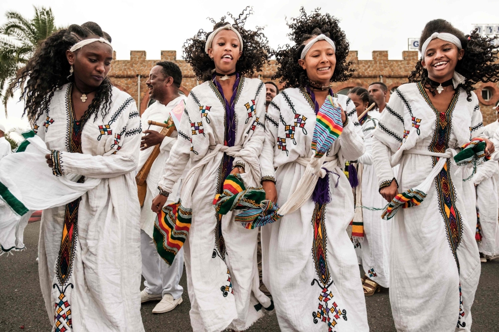 Women dance as they wait for the arrival of Eritrea’s president at the airport in Gondar, northern Ethiopia, on Friday. — AFP