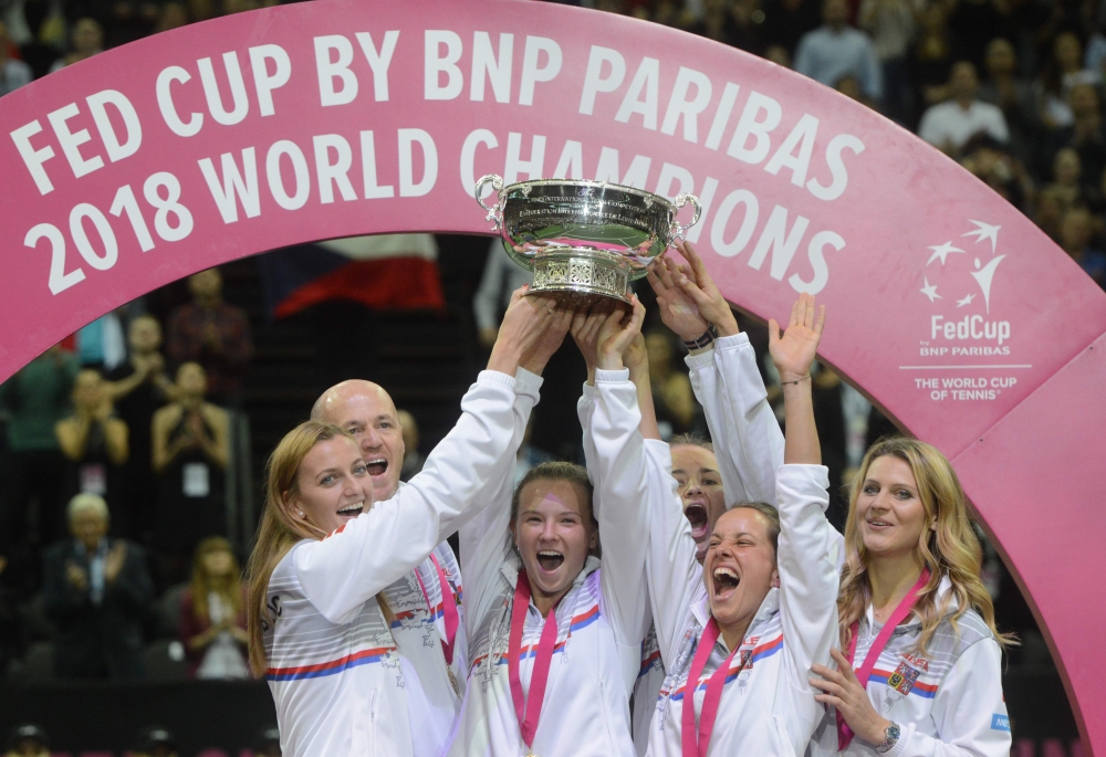 Members of Czech Fed Cup team, Petra Kvitova, Captain Petr Pala, Katerina Siniakova, Barbora Krejcikova, Barbora Strycova and Lucie Safarova pose with the trophy after the Fed Cup World Group final tennis match between Czech Republic and United States on Sunday in O2 Arena in Prague. — AFP 