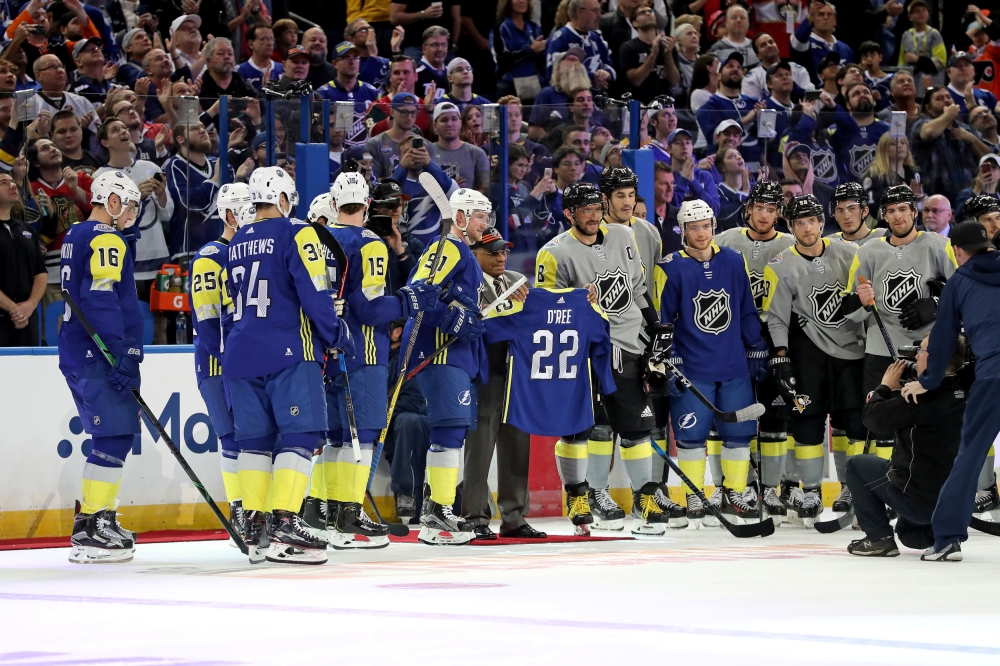 Atlantic Division All-Stars and Metropolitan Division All-Stars pose for a picture with former hockey player Willie O'Ree (22) during the 2018 NHL All Star Game at Amalie Arena. — Reuters