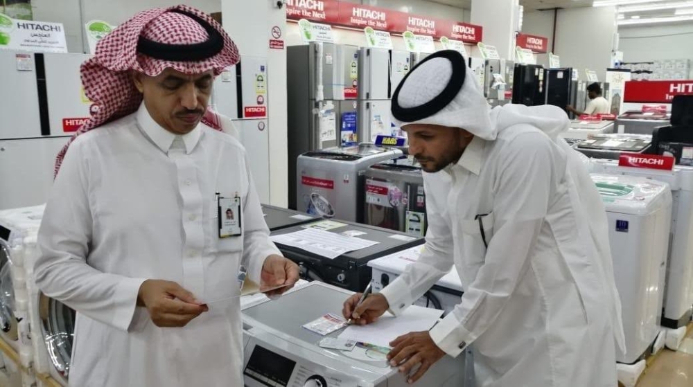


Labour Ministry officials inspect an electrical appliances shop in Al-Jouf.