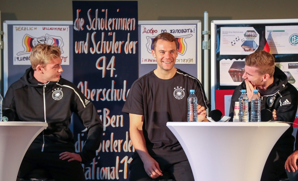 (L-R) Germany's forward Julian Brandt, Germany's goalkeeper Manuel Neuer and Germany's forward Timo Werner attend a question and answer session with students of the sport high school in Leipzig, eastern Germany on Tuesday, two days before an international friendly match Germany vs Russia. — AFP