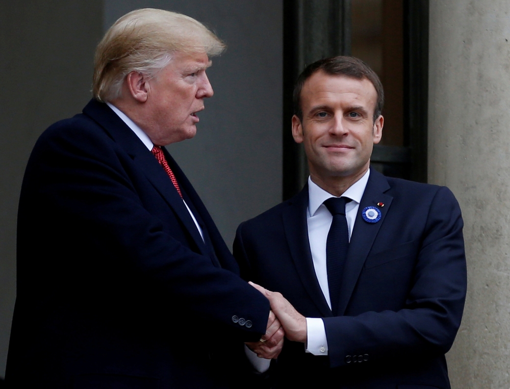 French President Emmanuel Macron shakes hands with US President Donald Trump after a meeting at the Elysee Palace on the eve of the commemoration ceremony for Armistice Day, 100 years after the end of the World War I, in Paris, France, in this Nov. 10, 2018 file photo. — Reuters