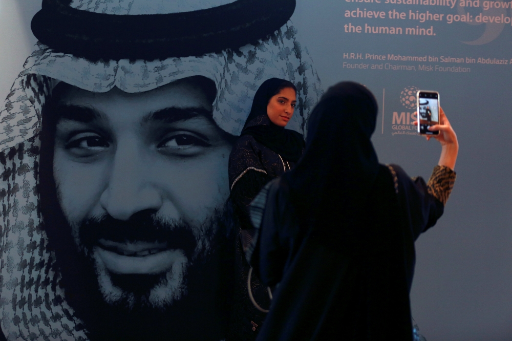 


Participants take photos next to a picture of Crown Prince Muhammed Bin Salman, deputy premier and minister of defense, during the Misk Global Forum in Riyadh on Wednesday. — Reuters