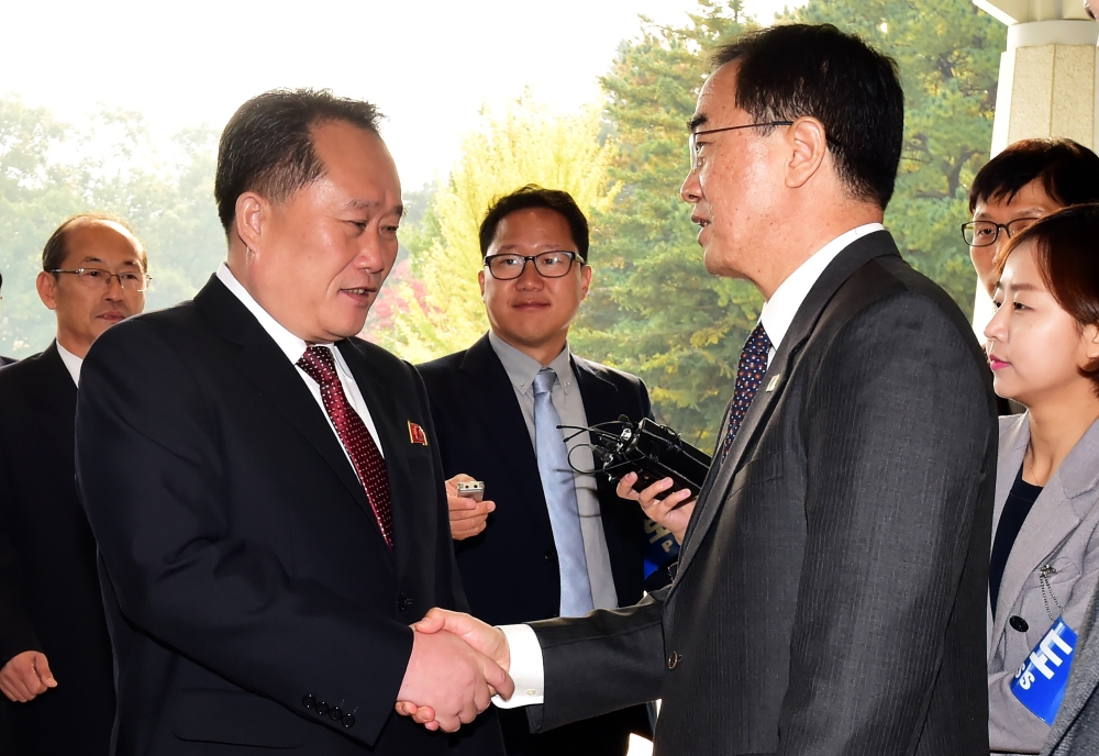 South Korean Unification Minister Cho Myoung-gyon, right, greets his North Korean counterpart Ri Son Gwon, left, before their meeting at the southern side of the border truce village of Panmunjom in the Demilitarized Zone (DMZ) dividing the two Koreas in this Oct. 14, 2018 file photo. — AFP