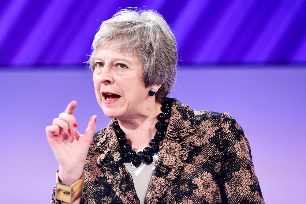 


British Prime Minister Theresa May replies to questions after speaking at the Confederation of British Industry’s (CBI) annual conference in London, on Monday. — Reuters