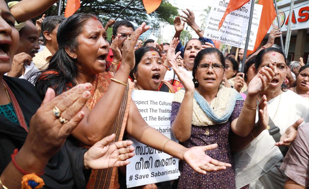 Hindu activists protest following the arrest of devotees at Sabarimala temple in Kochi in the southern state of Kerala on Monday. — AFP