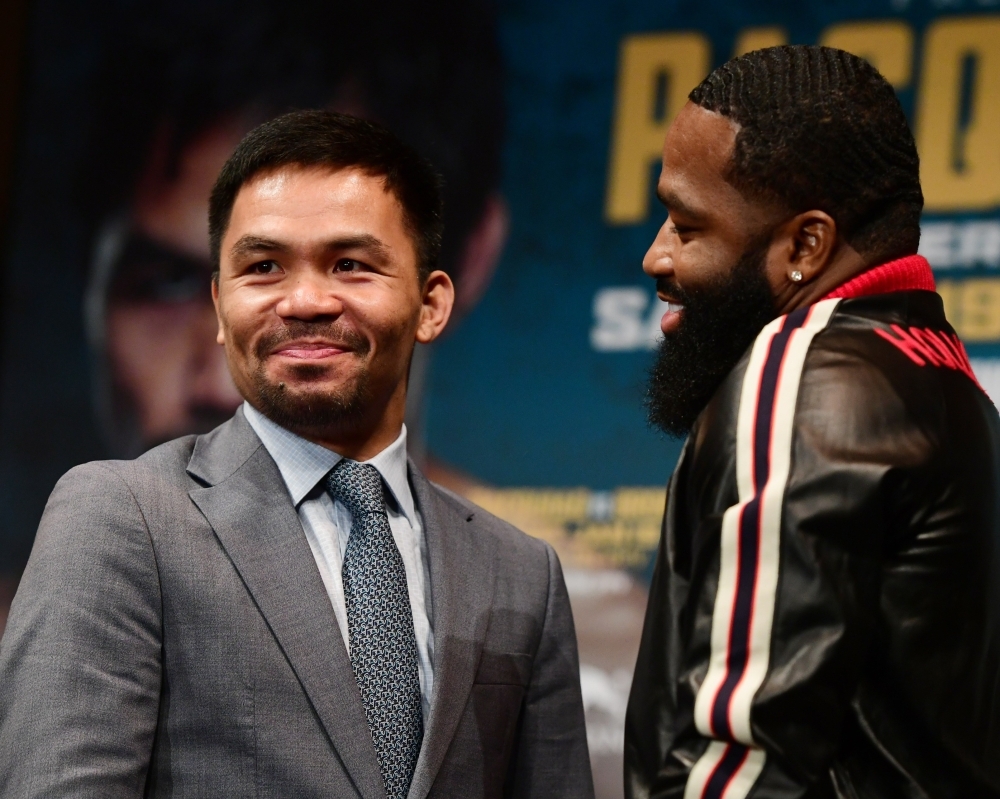 Manny Pacquiao (L) and Adrien Broner face off during a press conference on Monday in New York at Gotham Hall in preparation for their upcoming match, set to take place on Jan. 19, 2019 in Las Vegas. — AFP