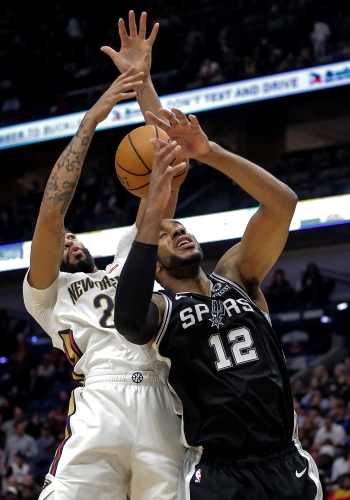 New Orleans Pelicans forward Anthony Davis (23) and San Antonio Spurs forward LaMarcus Aldridge (12) battle for a rebound during the second half at the Smoothie King Center. — Reuters