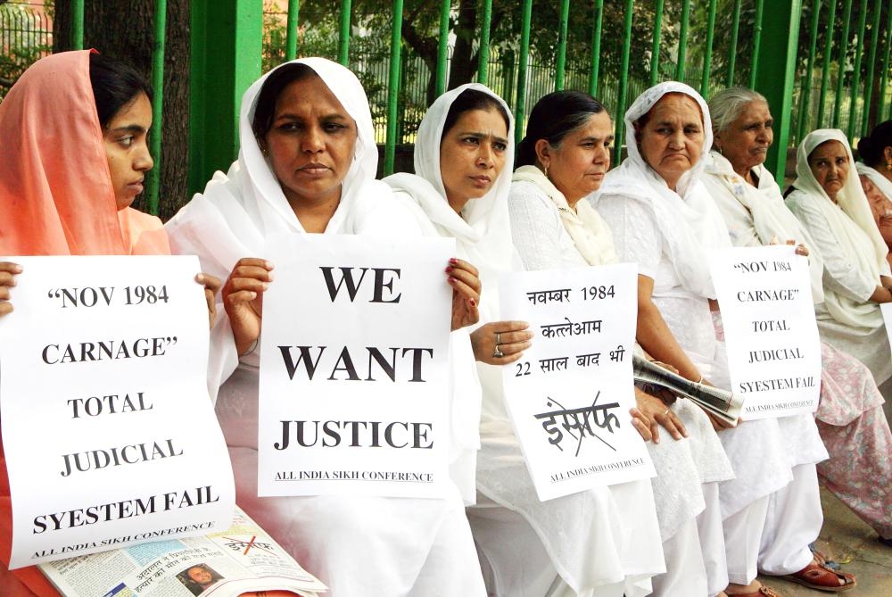 


Relatives of Indian Sikhs killed in the 1984 riot hold placards during a protest demanding justice in New Delhi in this Oct. 31, 2006 file photo. — AFP