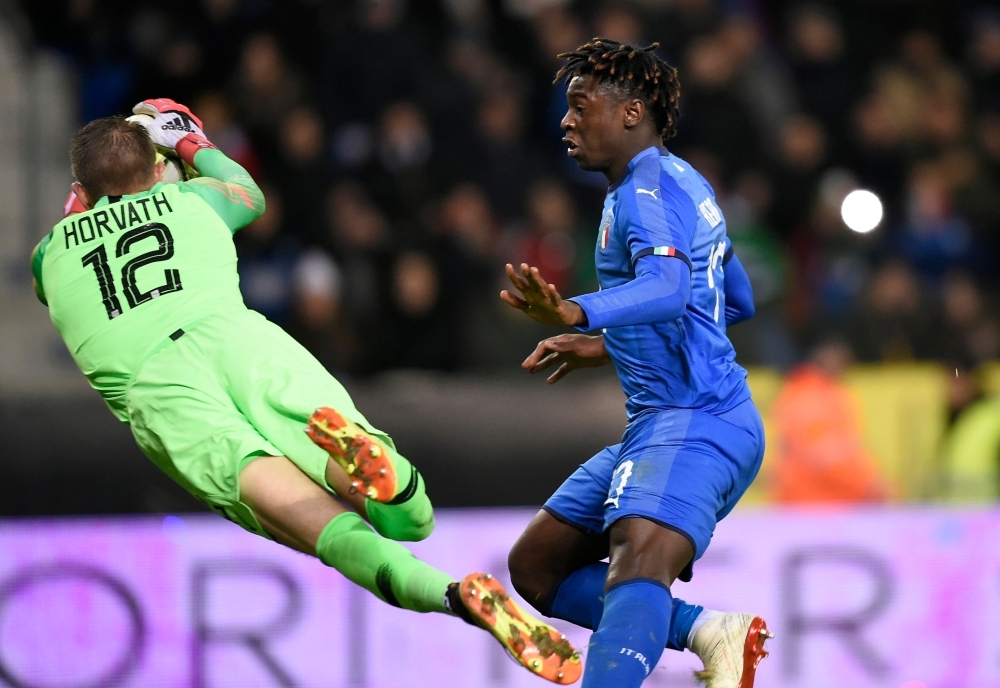 Unites States' goalkeeper Ethan Horvath (L) saves the ball in front of Italy's forward Moise Kean (R) during the friendly football match between Italy and the USA at the Luminus Arena Stadium in Genk on Tuesday. — AFP