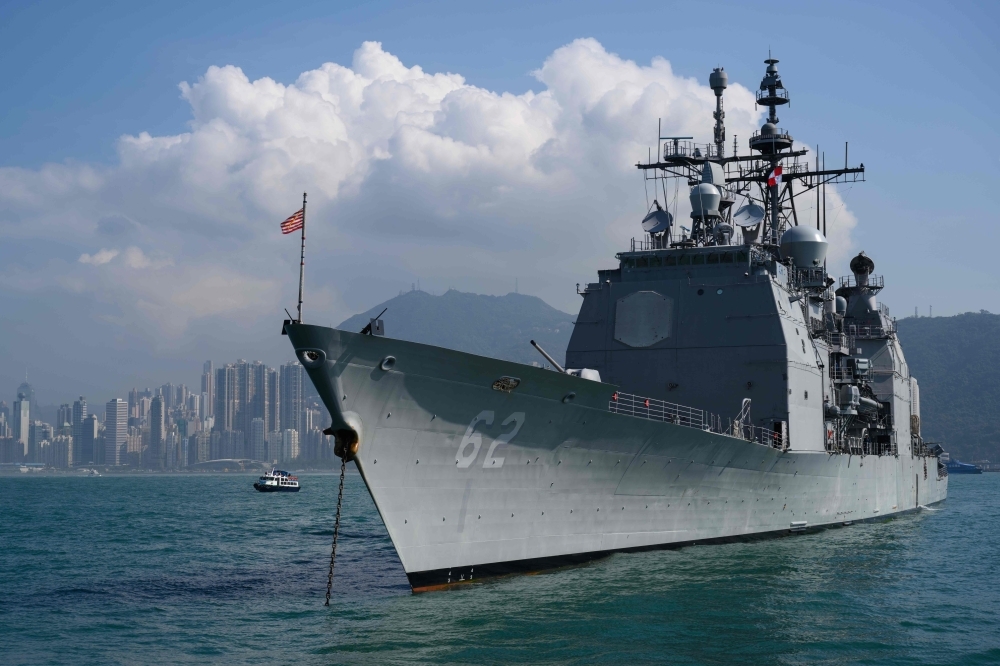 The US Navy’s USS Chancellorsville (CG-62) guided missile destroyer is seen anchored during a joint port visit with the USS Ronald Reagan (CVN-76) aircraft carrier (not seen) in Hong Kong on Wednesday. — AFP