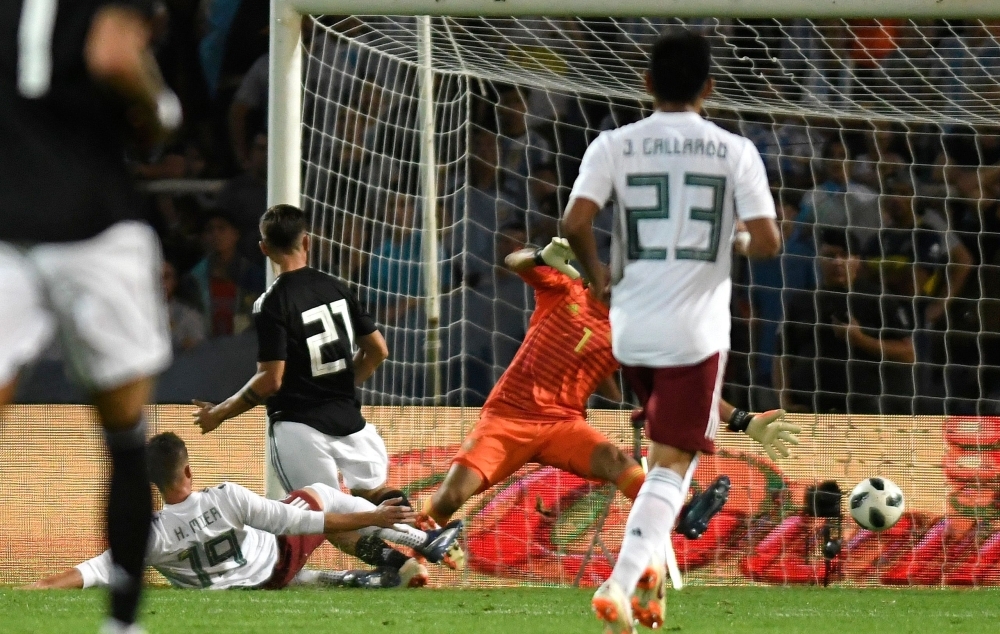 


Argentina’s Paulo Dybala (21) strikes the ball to score the team’s second goal against Mexico during their friendly football match at the Malvinas Argentinas stadium in Mendoza, Argentina, on Tuesday. — AFP