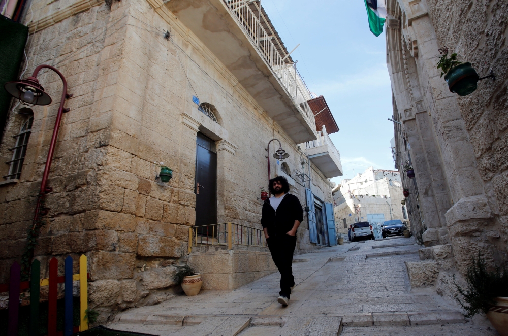 Palestinian musician Firas Harb walks in Beit Sahour, in the occupied West Bank, in this Nov. 20, 2018 file photo. — Reuters