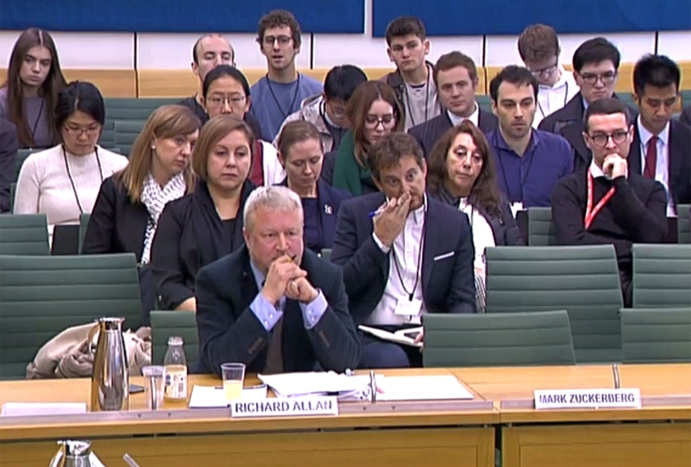 A still image taken from video footage broadcast by the UK Parliament Parliamentary Recording Unit (PRU) on Tuesday shows Richard Allan, left, vice president of Policy Solutions, Facebook, sat next to a vacant seat for Facebook Chief Executive Mark Zuckerberg, who declined the invitation to attend, giving evidence before an ‘International Grand Committee’ with representation from nine parliaments, on the Digital, Culture, Media and Sport Committee investigation into disinformation and ‘fake news’ at the Houses of Parliament in London on Tuesday. — AFP