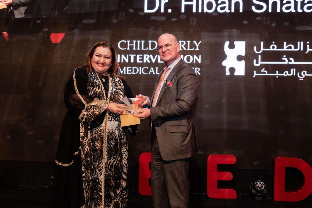 Saudi national Dr. Hibah Shata, Managing Director & Co Founder of Child Early Intervention Medical Centre, is presented with the Female Leader of the Year award 

