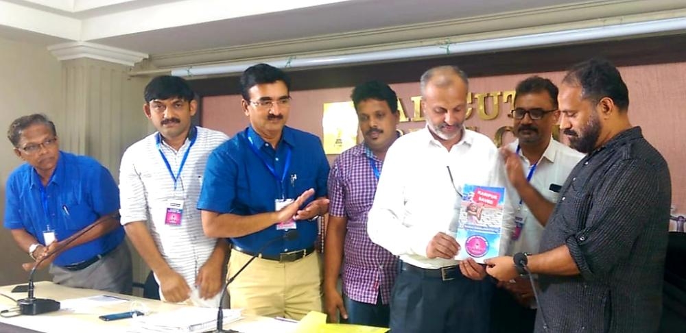 Kamal Varadoor, president of Kerala Union of Working Journalists, launching the booklet issued by Malabar Development Forum on the occasion of its Karippur Victory Day in Calicut on Monday. K.M Basheer, president of MDF, and other officials are also seen. 