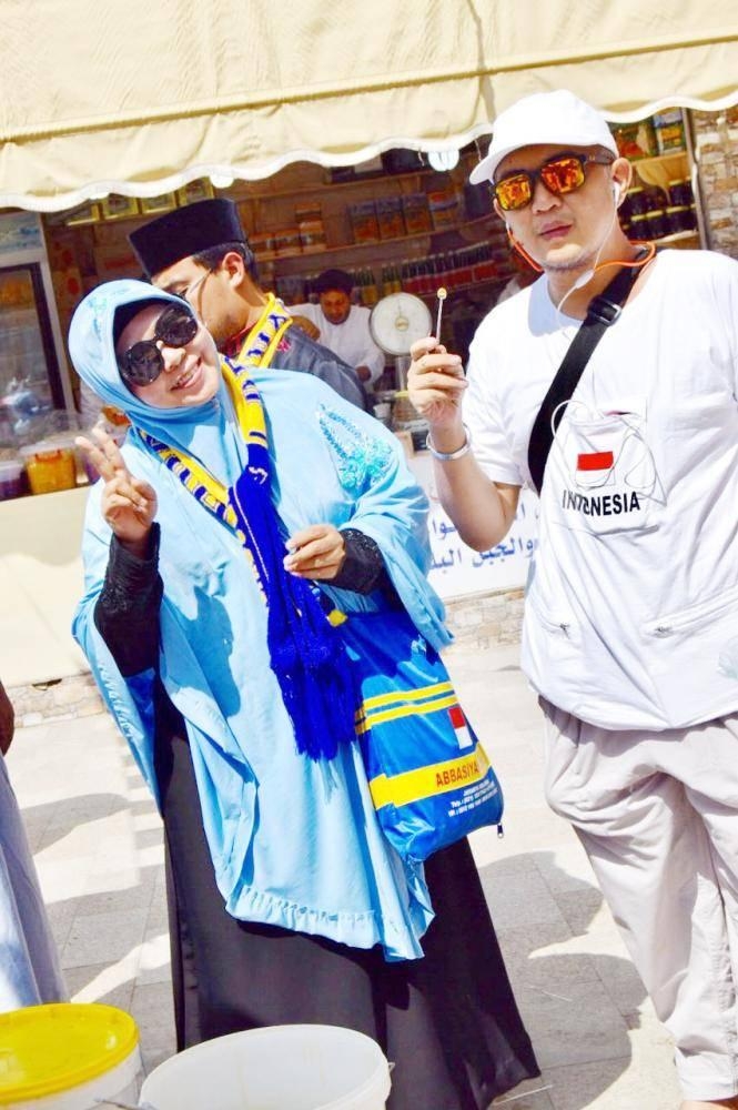 Foreign tourists visit a historic area of Taif.