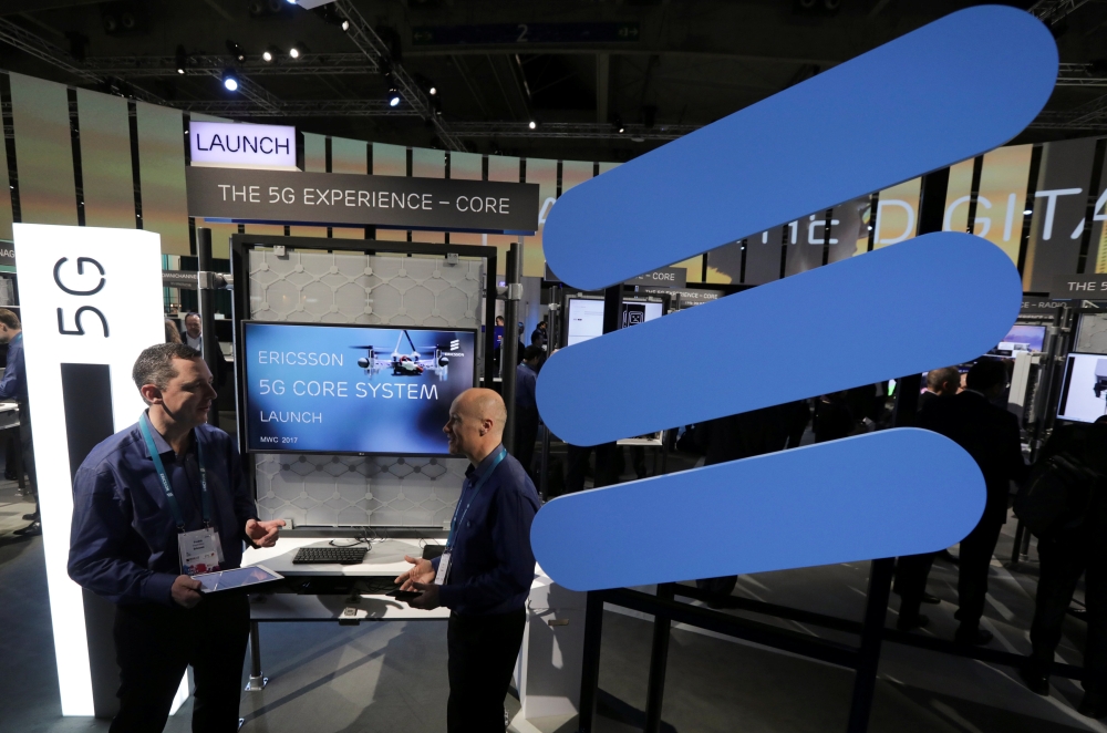 Ericsson's employees stand inside their booth at Mobile World Congress in Barcelona, Spain, in this file photo. — Reuters
