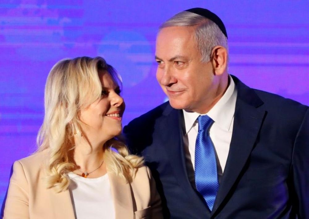 The Netanyahus have been questioned by Israeli police on a raft of different graft allegations, with Sara (left) grilled on Friday over new suspicions of fraudulently misusing public funds.