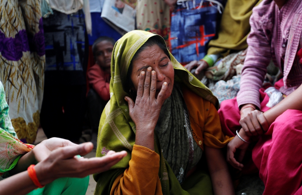 


A relative of Yogesh Raj, a Hindu activist, cries after Raj got arrested for leading the protests in which two people died on Monday, in Nayabans village in Bulandshahr district, Uttar Pradesh. — Reuters