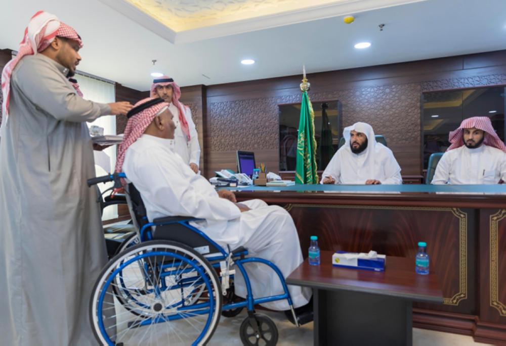Minister of Justice and President of the Supreme Judicial Council Sheikh Walid Al-Samaani meets beneficiaries of judicial services during an event in Makkah on Monday. — SPA