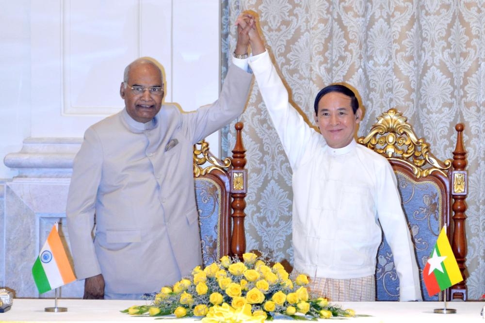 


Indian President Ram Nath Kovind, left, with his Myanmar counterpart Win Myint join hands after witnessing the signing of a memorandum of understanding during a ceremony at the presidential palace in capital Naypyidaw on Tuesday. — AFP