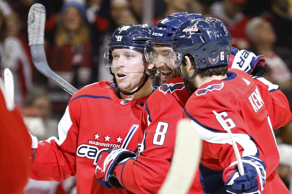 


Washington Capitals’ left wing Alex Ovechkin (C) celebrates with Nicklas Backstrom (L) and Michal Kempny after scoring a goal against the Detroit Red Wings during their NHL game at Capital One Arena in Washington Tuesday. — Reuters 