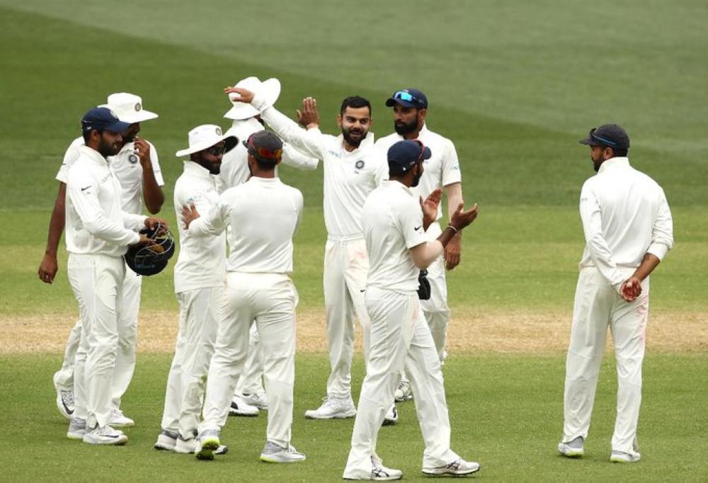 India skipper Virat Kohli, seen celebrating with his teammates during the Adelaide Test, was undaunted Thursday despite losing prolific spinner Ravichandran Ashwin and batsman Rohit Sharma to injury.