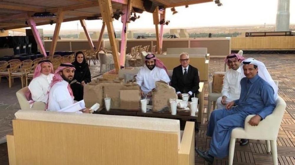 Crown Prince Muhammad Bin Salman, deputy premier and minister of defense, with a group of officials organizing Al-Diriyah Formula E-Prix race. — Courtesy Al Arabiya English