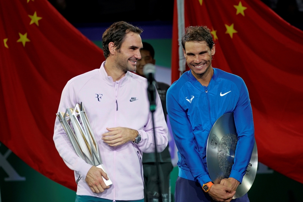 Winner Roger Federer of Switzerland and Rafael Nadal of Spain after the Men's singles final at the Shanghai Masters tennis tournament in Shanghai, China, in this file photo. — Reuters