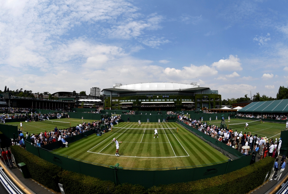 Doubles matches are being played during Wimbledon on the outside courts of the All England Lawn Tennis and Croquet Club, London, Britain, in this file photo. — Reuters