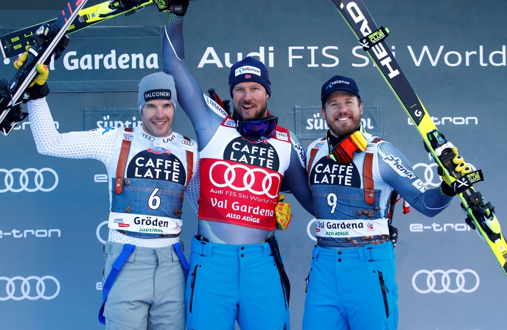 Norway's Aksel Lund Svindal celebrates his Alpine Skiing World Cup Men's Super G win with second placed Italy's Christof Innerhofer and third placed Norway's Kjetil Jansrud at Val Gardena, Italy, on Friday. — Reuters