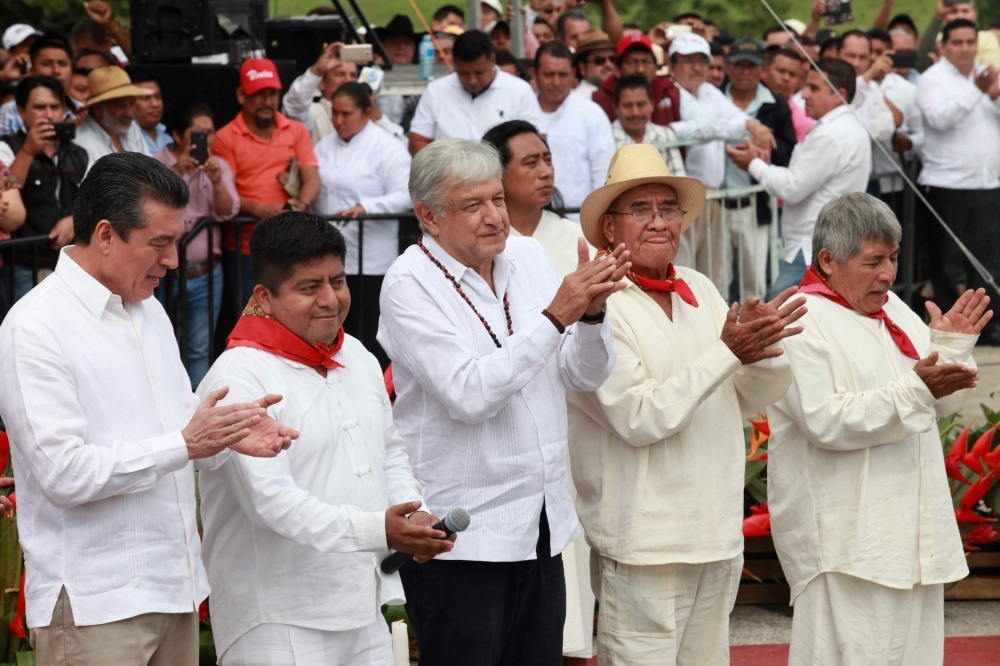 President Andres Manuel Lopez Obrador, center, takes part in the ceremony to launch the construction of the Tren Maya, a new railway network in the Yucatan peninsula in southeast Mexico, in Palenque, Chiapas state, on Sunday. — AFP