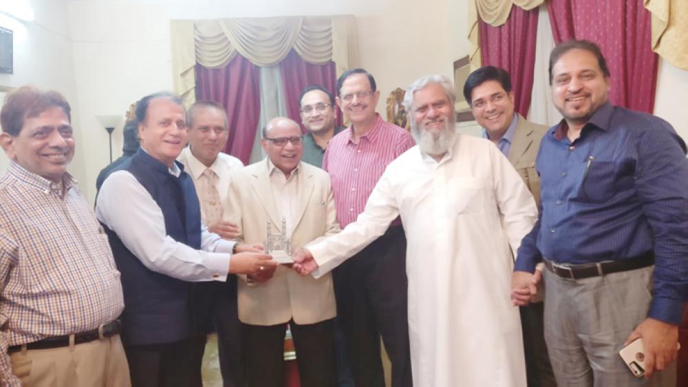 Members of the ICSJ and Bazm-e-Osmania present a memento to Dr. Dilshad Ahmed Shamsi. Photo shows from left, Iqbal Sheikh Al-Sulkar, Arif Quraishi, Dr. Haroon Rasheed, Dr. Shamsi, Zeeshan Khan, Dr. M.S. Karimuddin, Aziz Kidwai, Syed Fazal Ul Haque, and Ameen Ansari.