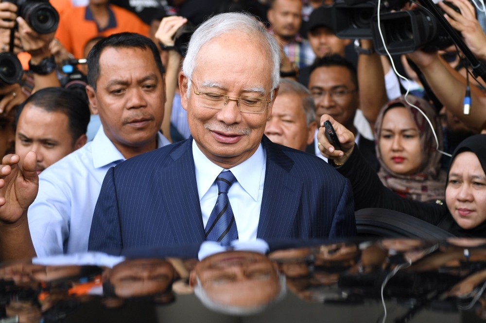 Former Malaysia’s Prime Minister Najib Razak leaves the courthouse in Kuala Lumpur after being charged in court in this Dec. 12, 2018 file photo. — AFP