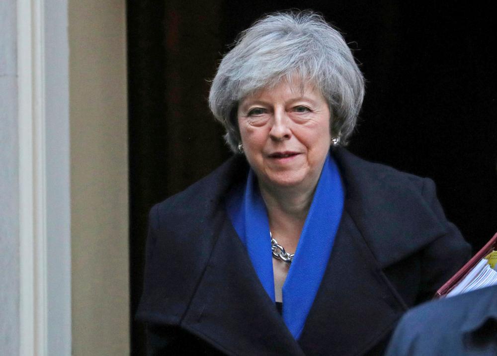 Britain’s Prime Minister Theresa May leaves 10 Downing Street in London on Wednesday. — Reuters