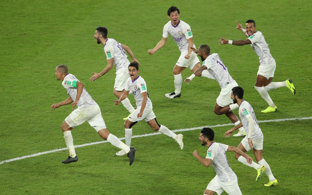 Al Ain players celebrate winning the penalty shootout against River Plate in the semifinal match of the Club World Cup Football Championship at Hazza Bin Zayed Stadium, Al Ain City, Tuesday. — Reuters