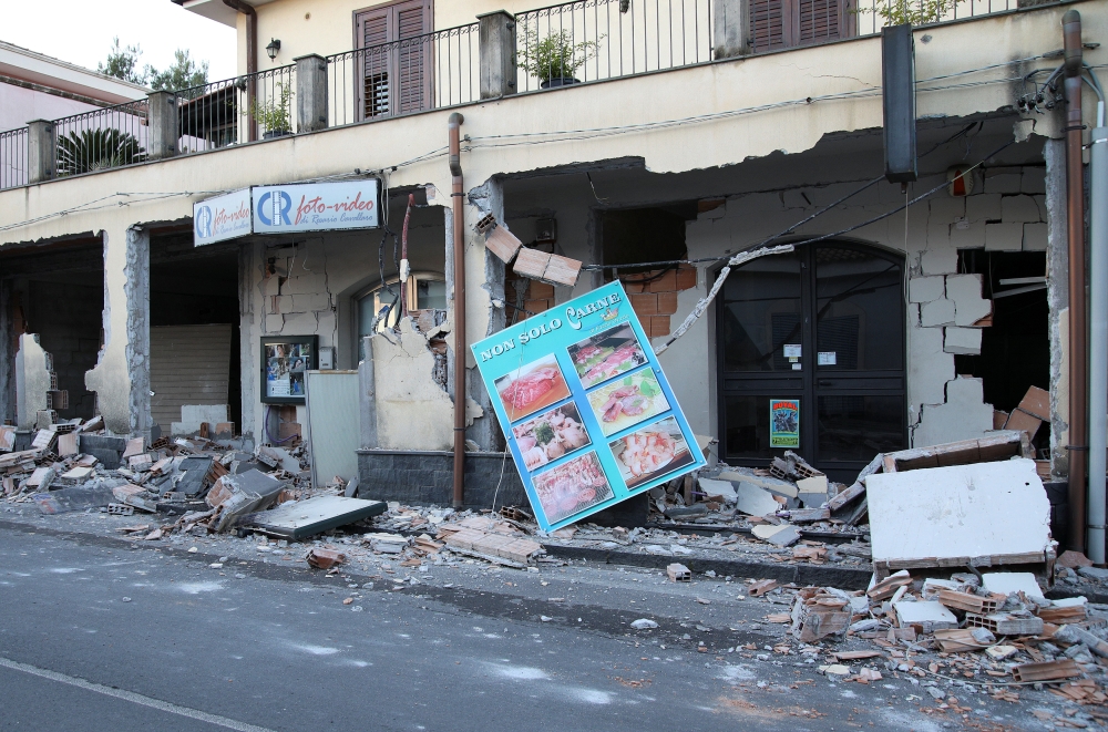 Shops are seen damaged by an earthquake, measuring magnitude 4.8, at the area north of Catania on the slopes of Mount Etna in Sicily, Italy, on Wednesday. — Reuters